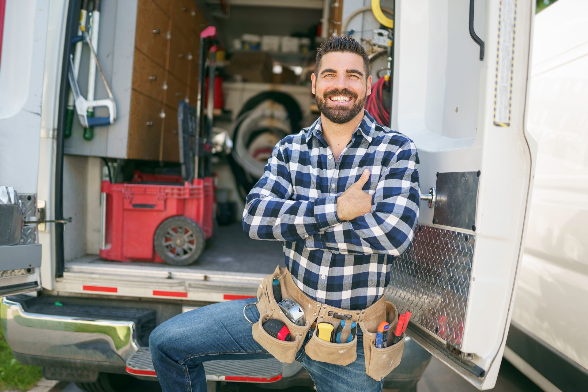 Portrait of an electrician happy worker at work